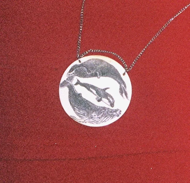 Ivory scrimshaw necklace 2.5 in dia.